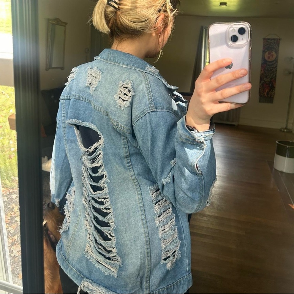 Blue denim jacket with a distressed look